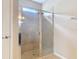 Bathroom shower with tiled walls, glass door and chrome fixtures at 669 E Victoria Trails Blvd, Deland, FL 32724