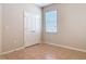 Neutral bedroom featuring a double door closet and a window for natural light at 669 E Victoria Trails Blvd, Deland, FL 32724