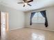 Bedroom with tile flooring, neutral walls, a ceiling fan and natural light at 669 E Victoria Trails Blvd, Deland, FL 32724