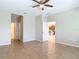 Spacious bedroom with tile flooring, a ceiling fan and two closets at 669 E Victoria Trails Blvd, Deland, FL 32724