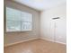 Bedroom with a large window and neutral colored walls and tile flooring at 669 E Victoria Trails Blvd, Deland, FL 32724