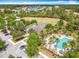 Aerial view of the community center surrounded by lush landscape and a sparkling pool at 669 E Victoria Trails Blvd, Deland, FL 32724