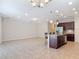 Open floor plan featuring kitchen island with seating and dark wood cabinetry at 669 E Victoria Trails Blvd, Deland, FL 32724