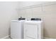 Laundry room with white washer and dryer and wire shelving above at 669 E Victoria Trails Blvd, Deland, FL 32724
