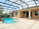 Enclosed in-ground pool and patio with outdoor living space at 669 E Victoria Trails Blvd, Deland, FL 32724