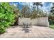 Cozy outdoor patio area with charming seating, perfect for relaxing in a private setting at 787 Ocean Shore Blvd, Ormond Beach, FL 32176