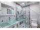 Updated bathroom featuring a glass bowl sink, frameless glass shower and modern fixtures at 787 Ocean Shore Blvd, Ormond Beach, FL 32176