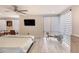 Modern bedroom with hardwood floors, and large windows with horizontal shades at 787 Ocean Shore Blvd, Ormond Beach, FL 32176