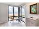 Comfortable seating area looks out onto an ocean view through large windows at 787 Ocean Shore Blvd, Ormond Beach, FL 32176