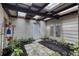 Relaxing courtyard featuring a skylight, potted plants, and stone paver flooring at 787 Ocean Shore Blvd, Ormond Beach, FL 32176