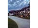 Concrete driveway lined with mature trees and manicured shrubs and palms at 787 Ocean Shore Blvd, Ormond Beach, FL 32176