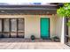 Welcoming home with a vibrant turquoise door and neatly manicured landscaping at 787 Ocean Shore Blvd, Ormond Beach, FL 32176