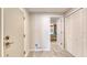 Hallway features access to a bedroom with unique stone accent wall and convenient closet space at 787 Ocean Shore Blvd, Ormond Beach, FL 32176