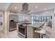 Well-equipped kitchen with stainless steel appliances, granite counters, and open design for easy entertaining at 787 Ocean Shore Blvd, Ormond Beach, FL 32176