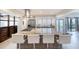 Spacious kitchen island with bar seating, stainless appliances, and easy access to outdoor views at 787 Ocean Shore Blvd, Ormond Beach, FL 32176