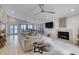 Open living room features a fireplace, modern lighting, and beachfront views at 787 Ocean Shore Blvd, Ormond Beach, FL 32176