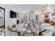 Cozy living room features a fireplace, large TV and comfortable seating at 787 Ocean Shore Blvd, Ormond Beach, FL 32176