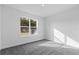 Clean bedroom with plush carpeting, large window, and minimalist design at 810 W 24Th St, Sanford, FL 32771