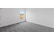 Bright and airy bedroom featuring carpeted floors and abundant natural light from the window at 810 W 24Th St, Sanford, FL 32771