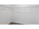 Walk-in closet with wire shelving and neutral carpet at 810 W 24Th St, Sanford, FL 32771