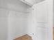 Empty walk-in closet with white wire shelving and wooden floor at 810 W 24Th St, Sanford, FL 32771