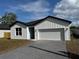 Beautiful exterior view of a single-Gathering home with a brick driveway and two-car garage at 810 W 24Th St, Sanford, FL 32771
