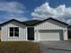 Inviting single-story home with a two-car garage, fresh landscaping, and neutral color palette at 810 W 24Th St, Sanford, FL 32771