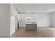 Stylish kitchen featuring white cabinets, stainless steel appliances, and a gray center island at 810 W 24Th St, Sanford, FL 32771