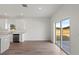 Bright, open-concept layout connecting kitchen and patio access via sliding glass door at 810 W 24Th St, Sanford, FL 32771