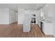 Open concept kitchen with stainless steel appliances, a center island, and hardwood floors at 810 W 24Th St, Sanford, FL 32771