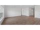 Expansive living area showcasing hard surface flooring and multiple entryways at 810 W 24Th St, Sanford, FL 32771