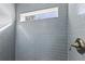 Detail shot of the tiled shower with a window at 810 W 24Th St, Sanford, FL 32771