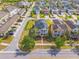 Lovely aerial view showcases home with solar panels, brick driveway, and fenced backyard at 8561 Randal Park Blvd, Orlando, FL 32832