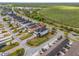 Aerial view of a well maintained home with a black fenced-in yard and a playground in a neighborhood at 8561 Randal Park Blvd, Orlando, FL 32832