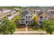 Beautiful aerial view of the home and neighborhood with a two-story porch at 8561 Randal Park Blvd, Orlando, FL 32832