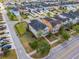 Gorgeous aerial view of home with a fenced yard, solar panels, and brick driveway at 8561 Randal Park Blvd, Orlando, FL 32832