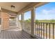 Balcony with white railing offers views of surrounding trees and the road at 8561 Randal Park Blvd, Orlando, FL 32832