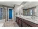 Bathroom features double sink vanity and a glass enclosed shower at 8561 Randal Park Blvd, Orlando, FL 32832