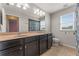 Bright bathroom features a double vanity, tile flooring, and neutral paint at 8561 Randal Park Blvd, Orlando, FL 32832