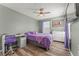 Bedroom features a ceiling fan, desk, and dresser at 8561 Randal Park Blvd, Orlando, FL 32832