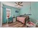 Bedroom with a desk, chair, and hanging swing at 8561 Randal Park Blvd, Orlando, FL 32832