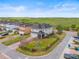 Charming home exterior featuring a fenced-in yard, green lawn, and brick driveway near a tree-lined street at 8561 Randal Park Blvd, Orlando, FL 32832