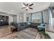 Spacious living room with hardwood floors, large sectional, stylish decor, and plenty of natural light at 8561 Randal Park Blvd, Orlando, FL 32832