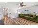 Second story loft features wood floors and an olive green sofa at 8561 Randal Park Blvd, Orlando, FL 32832