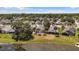 Aerial view of homes in a quiet neighborhood with ponds and mature trees at 914 Smokerise Blvd, Port Orange, FL 32127