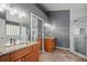 Bathroom with a glass shower, granite counters, double sinks and modern fixtures at 914 Smokerise Blvd, Port Orange, FL 32127