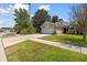 Inviting single-Gathering home featuring a well-maintained lawn, brick facade and attached two-car garage at 914 Smokerise Blvd, Port Orange, FL 32127