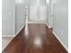 Hardwood hallway with white doors and light gray walls at 914 Smokerise Blvd, Port Orange, FL 32127
