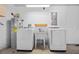 Functional laundry area with washer, dryer, utility sink, and water heater at 914 Smokerise Blvd, Port Orange, FL 32127