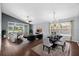 Open-concept living and dining area with stylish furniture, hardwood flooring, and abundant natural light at 914 Smokerise Blvd, Port Orange, FL 32127